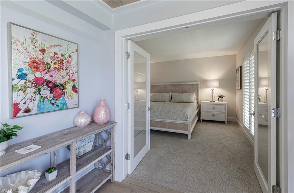 250 Park Shore Drive, Unit 302 Naples, FL 34103 - Photo 15 of 35 a living room with furniture