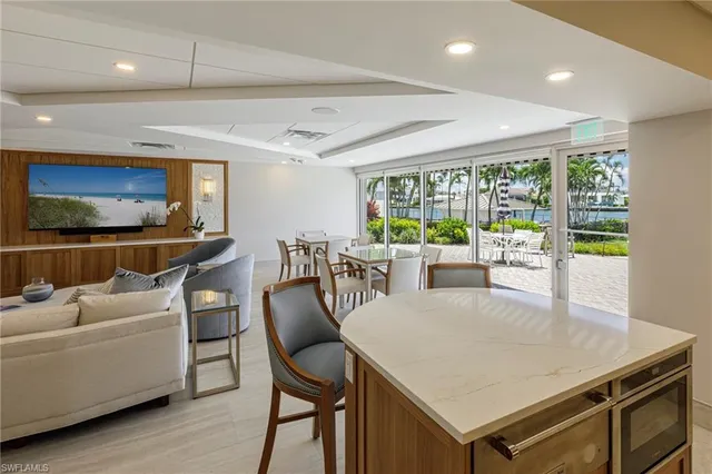 a view of a dining room with furniture window and outside view