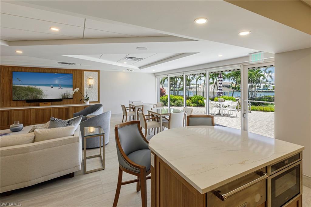 250 Park Shore Drive, Unit 302 Naples, FL 34103 - Photo 30 of 35 a view of a dining room with furniture window and outside view
