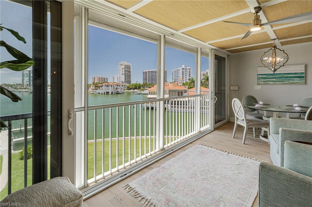 250 Park Shore Drive, Unit 302 Naples, FL 34103 - Photo 7 of 35 a view of a balcony with chairs