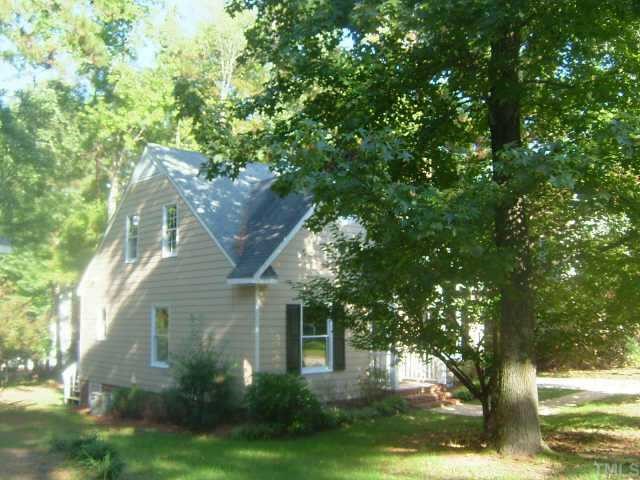 4709 Thurmount Place Raleigh, NC 27604 - Photo 1 of 5 a front view of a house with garden