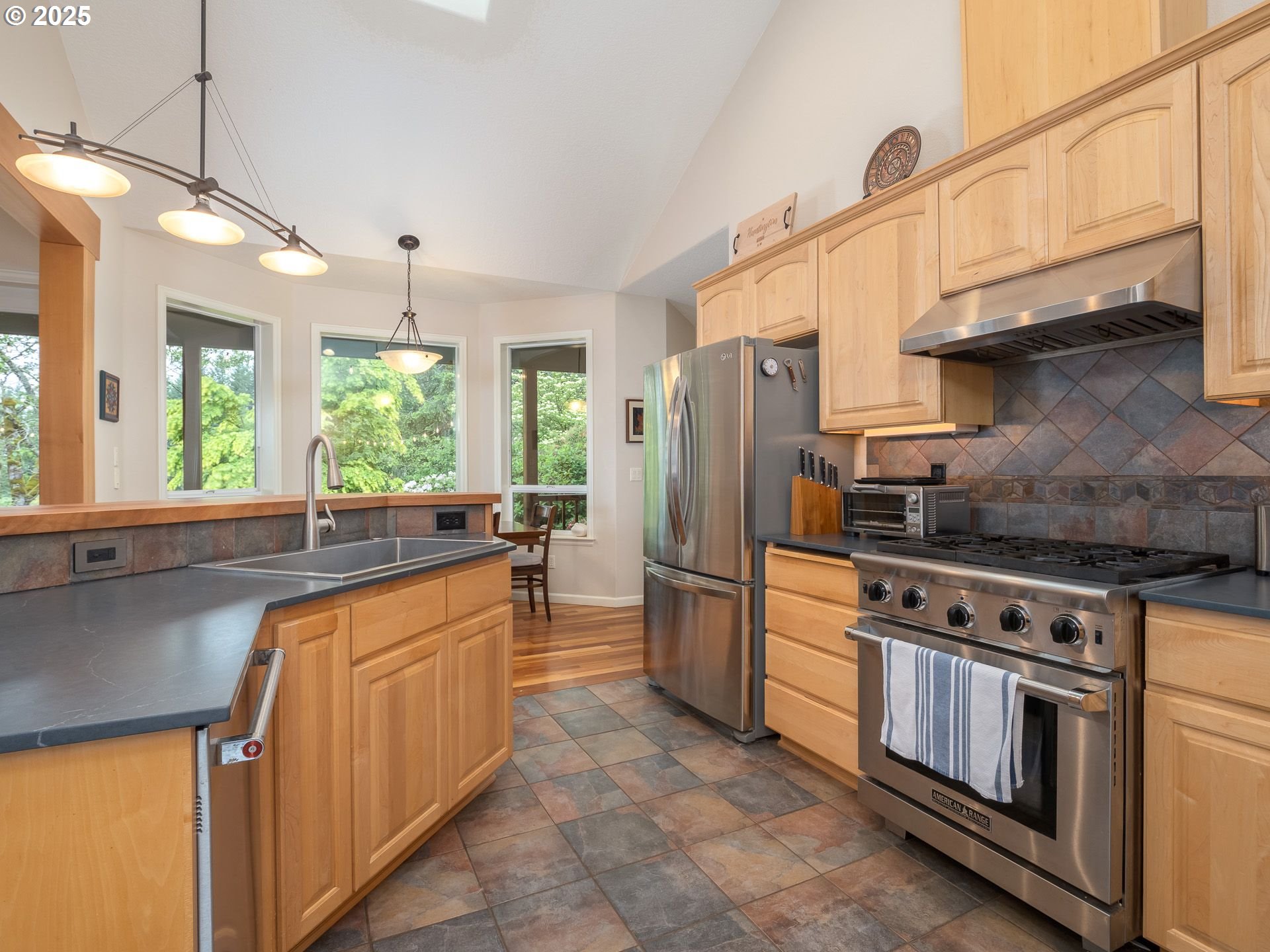 72 Patrick Lane Washougal, WA 98671 - Photo 20 of 48 a kitchen with stainless steel appliances granite countertop a stove a refrigerator and a sink