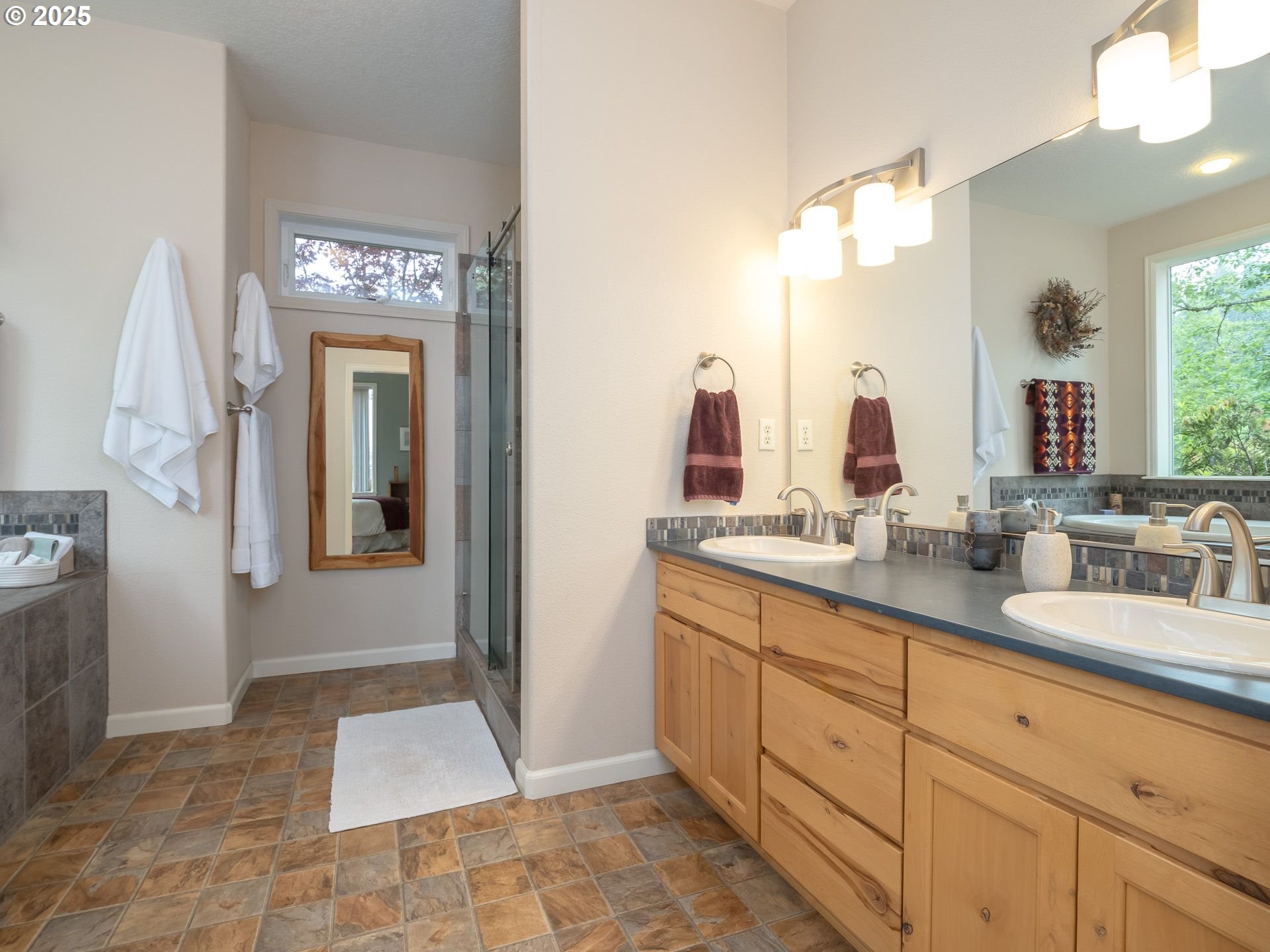 72 Patrick Lane Washougal, WA 98671 - Photo 26 of 48 a spacious bathroom with a double vanity sink and a mirror