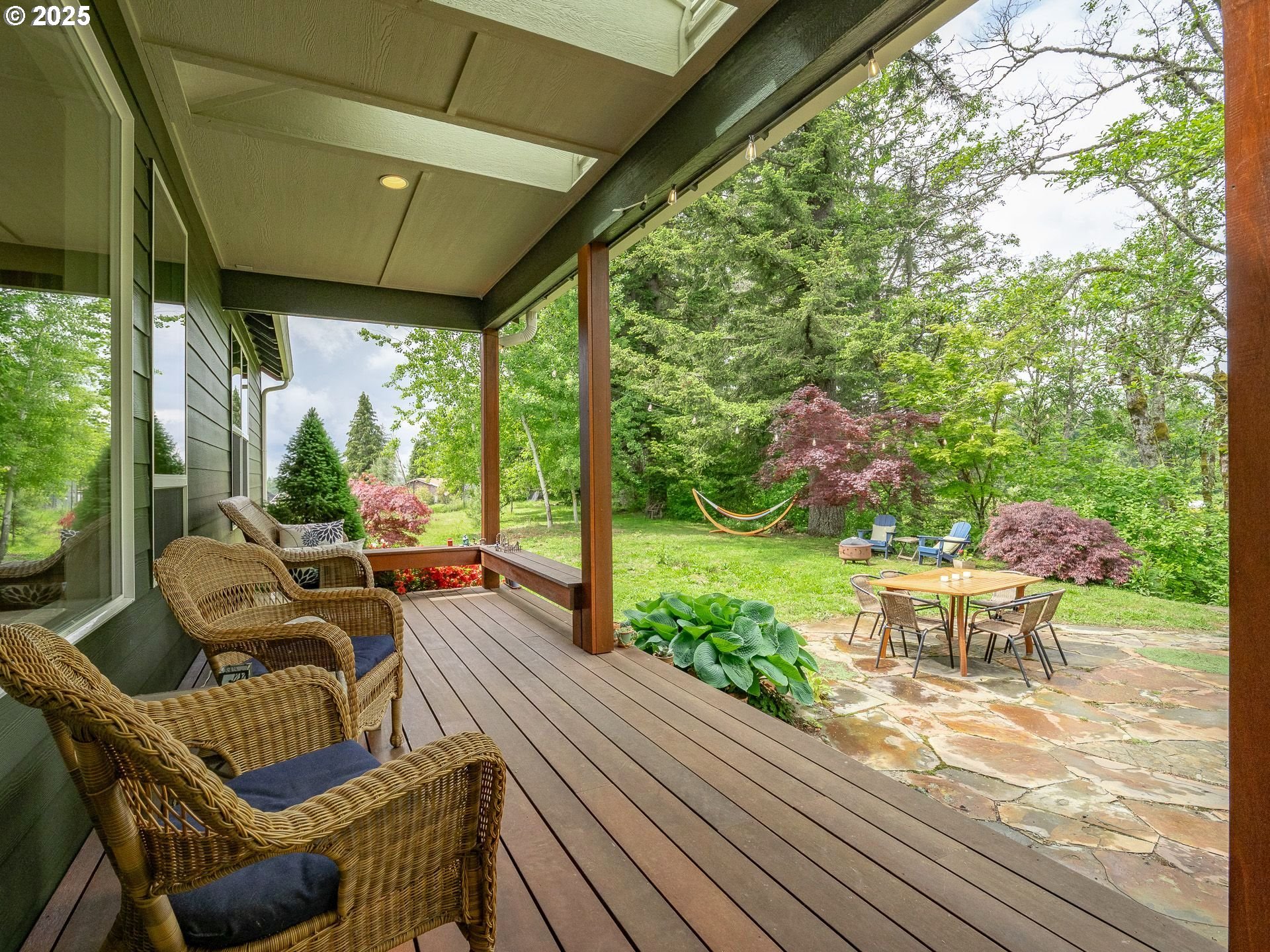 72 Patrick Lane Washougal, WA 98671 - Photo 10 of 48 a view of a patio with table and chairs potted plants with wooden floor and floor to ceiling window