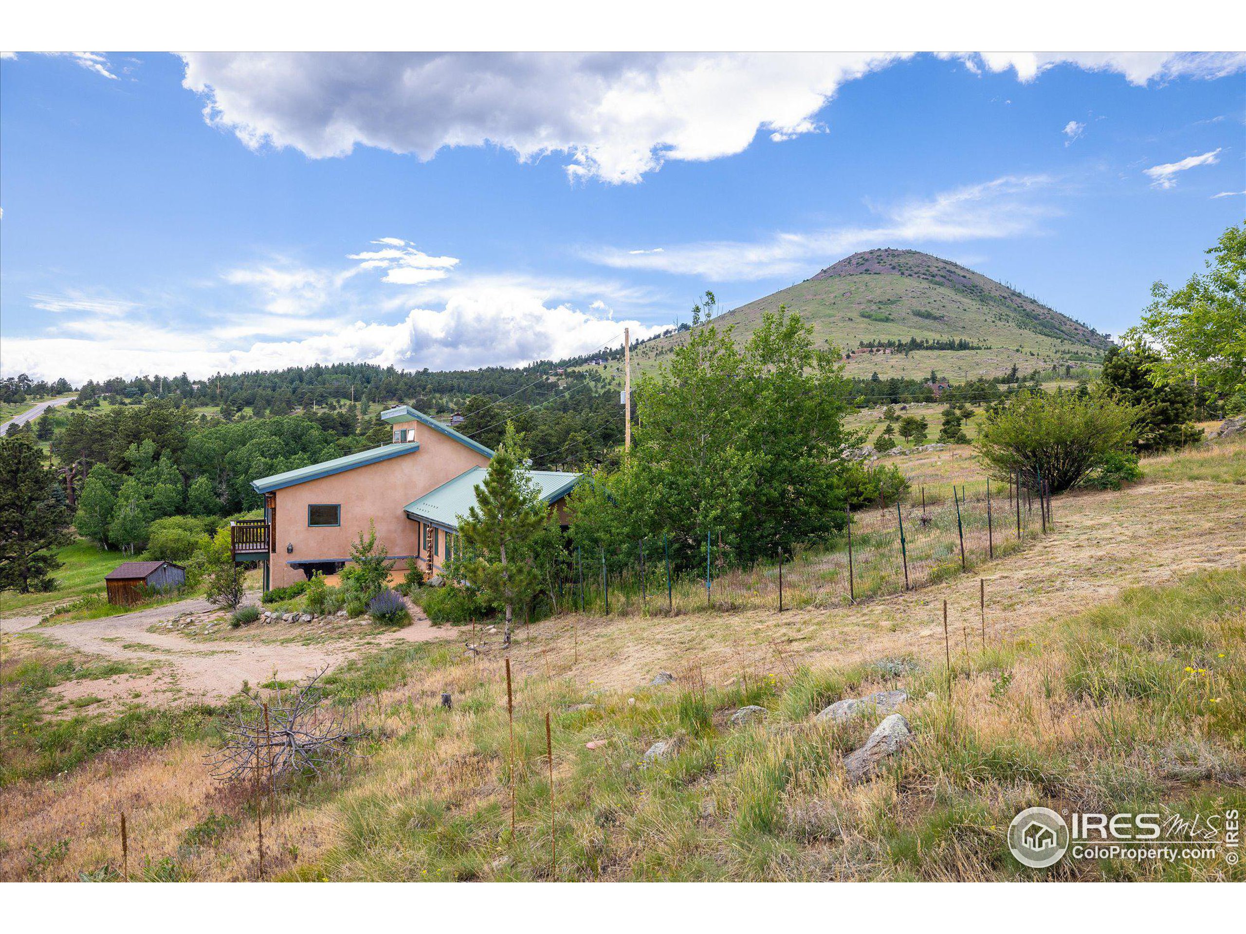 78 Old Post Road Boulder, CO 80302 - Photo 3 of 25 a front view of a house with a yard