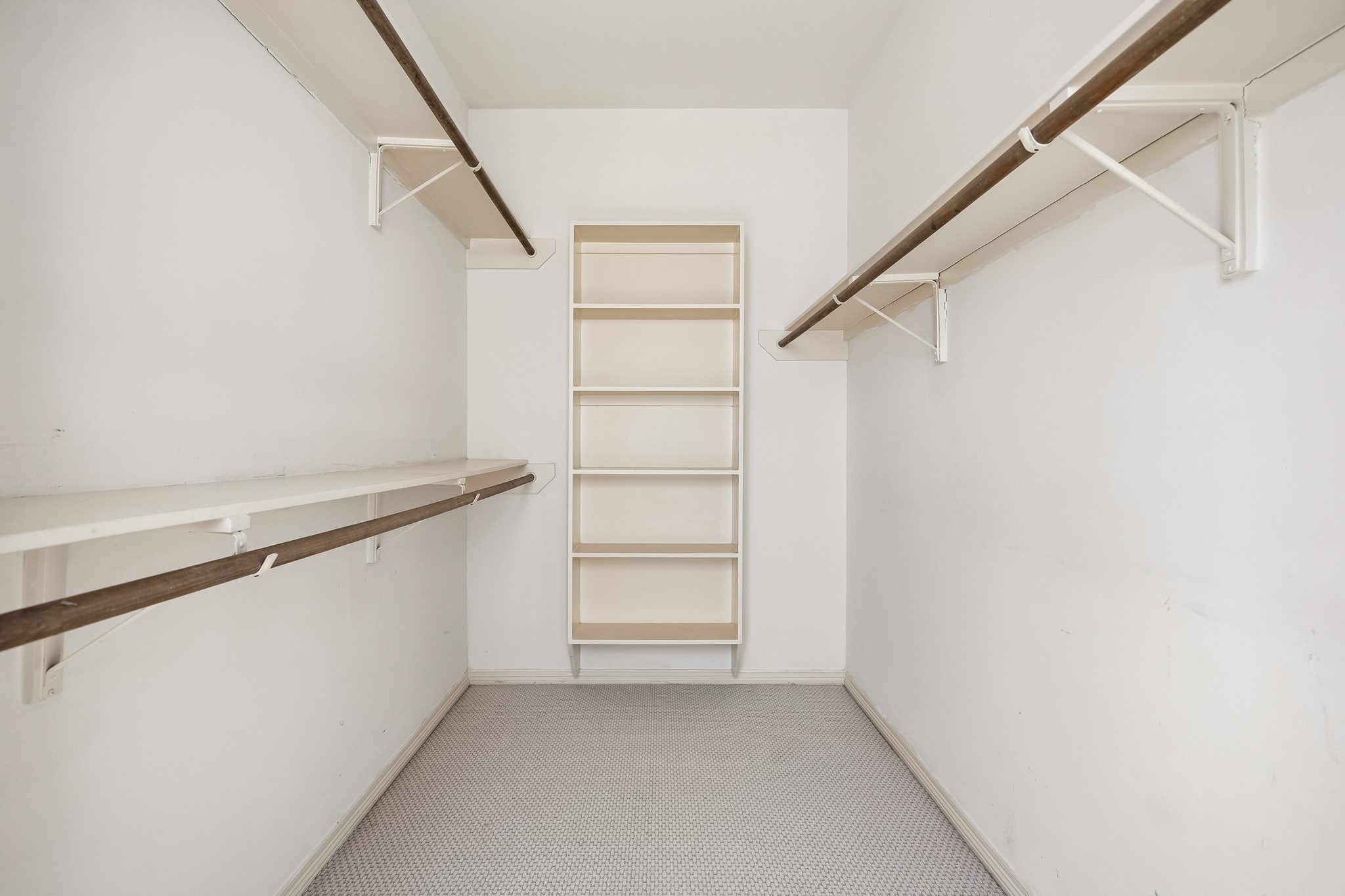 6022 Burgoyne Road Houston, TX 77057 - Photo 9 of 30 Generous walk-in closet with extensive hanging space, built-in shelving, and excellent storage.