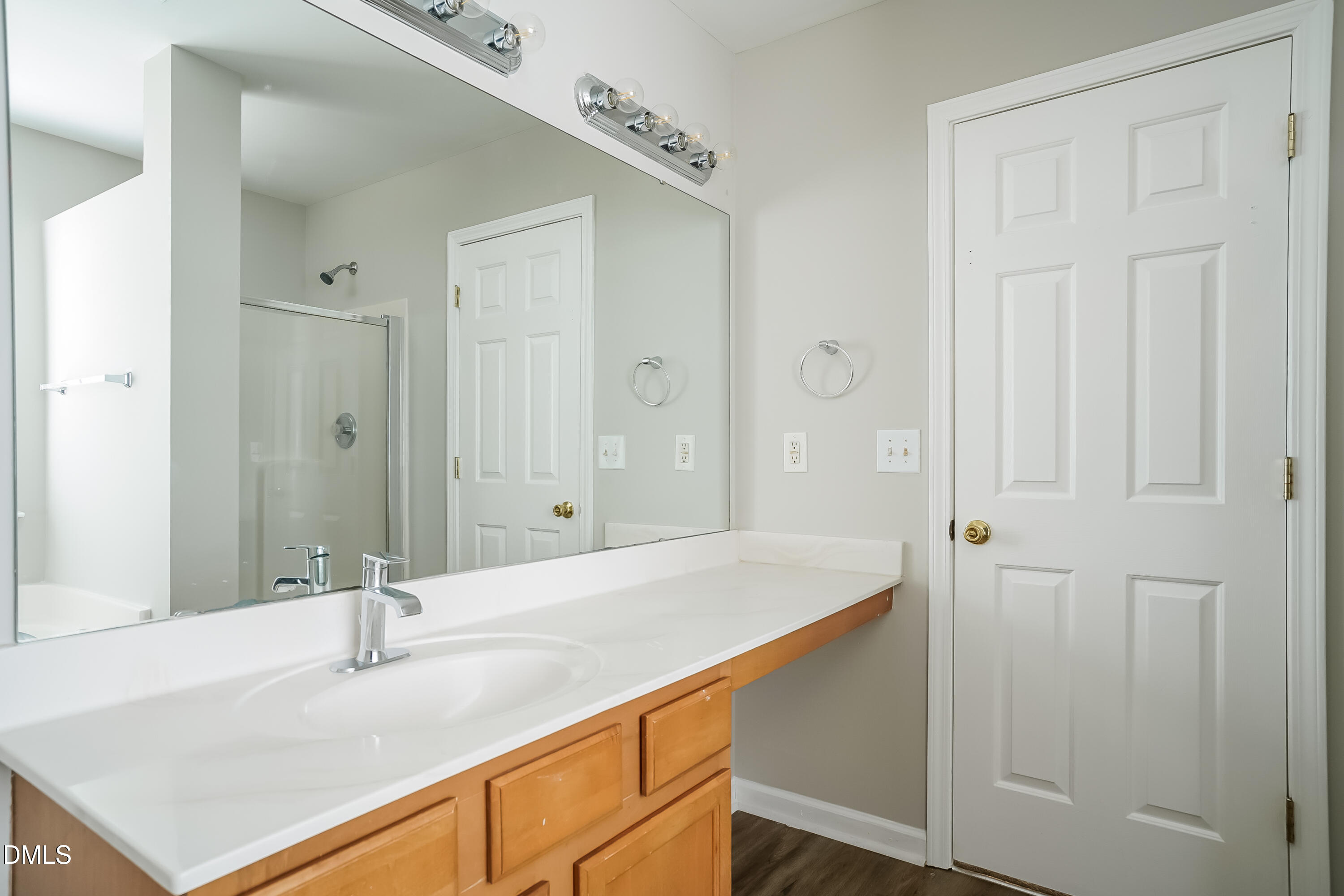 3567 Futura Lane Raleigh, NC 27610 - Photo 12 of 15 a bathroom with a sink and a mirror