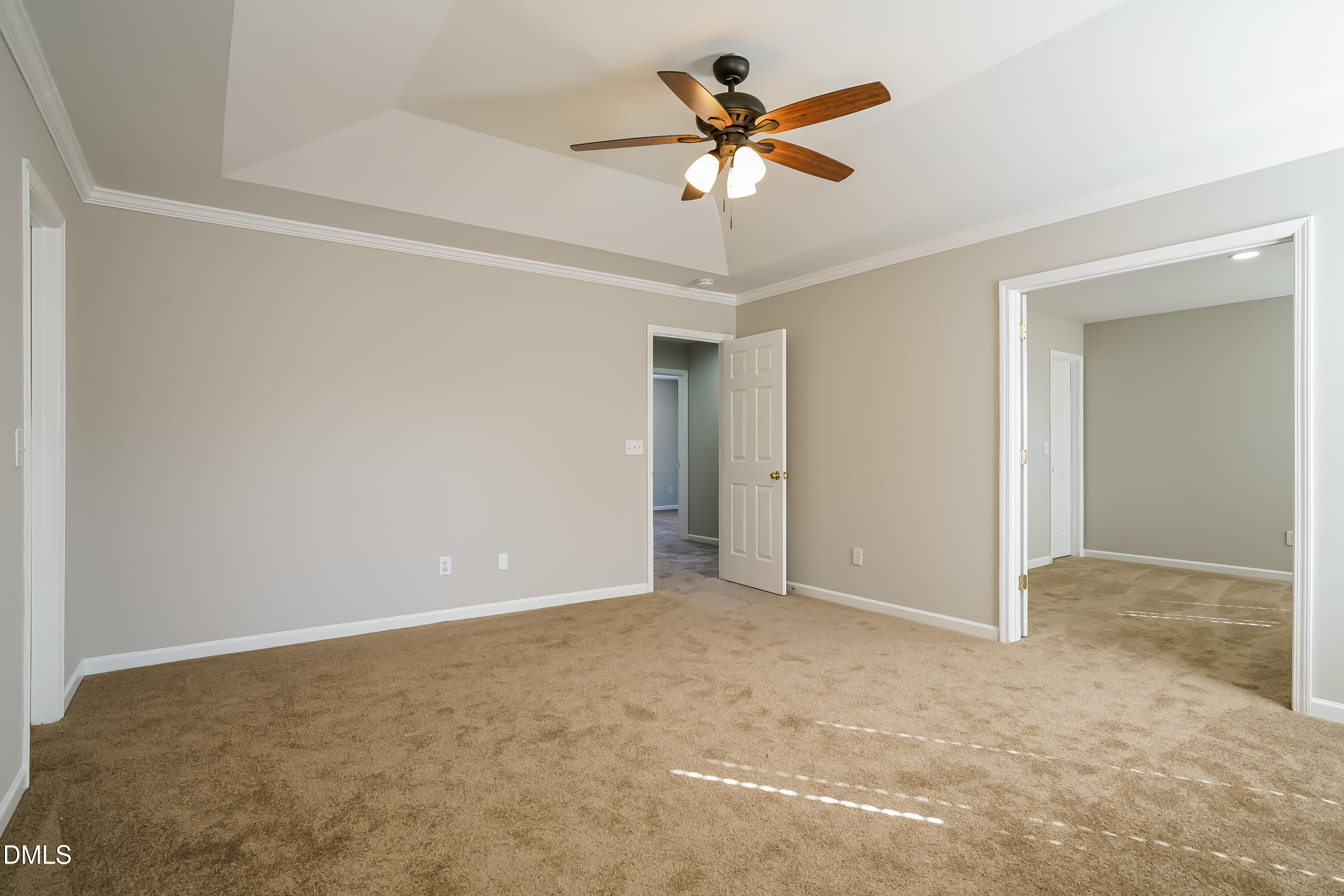 3567 Futura Lane Raleigh, NC 27610 - Photo 14 of 15 an empty room with a chandelier fan and a ceiling fan