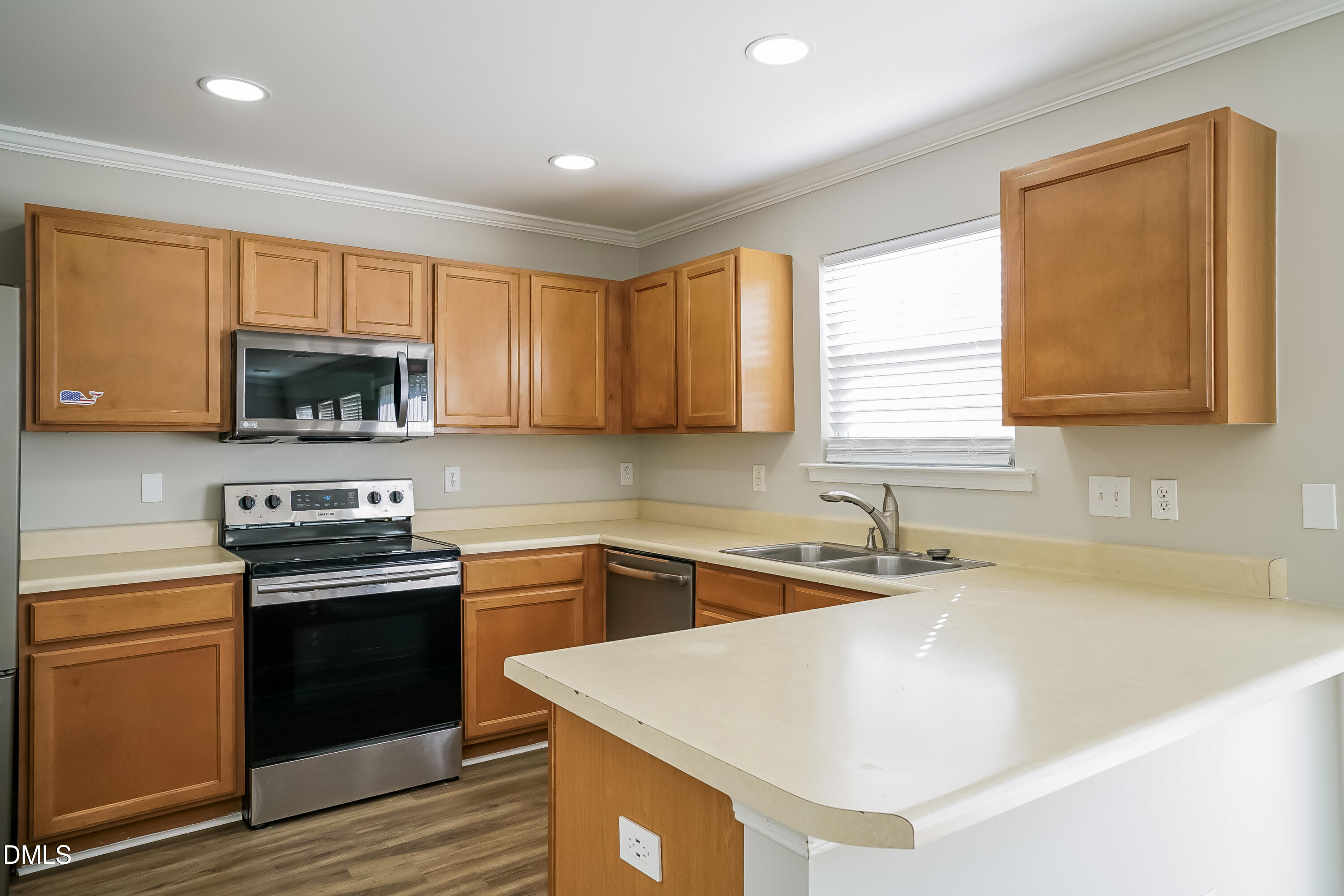 3567 Futura Lane Raleigh, NC 27610 - Photo 7 of 15 a kitchen with stainless steel appliances granite countertop a sink stove and microwave