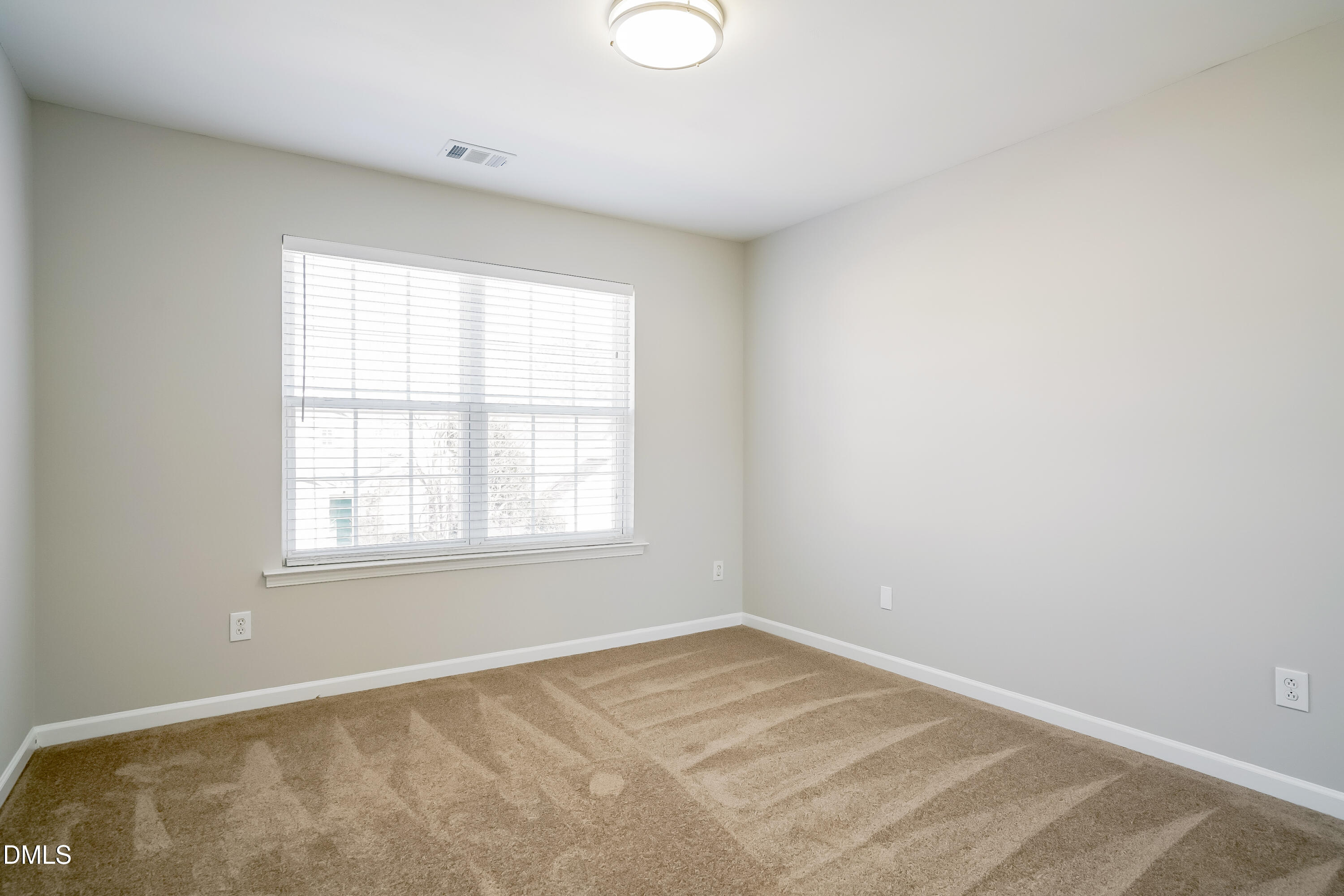 3567 Futura Lane Raleigh, NC 27610 - Photo 10 of 15 an empty room with a window