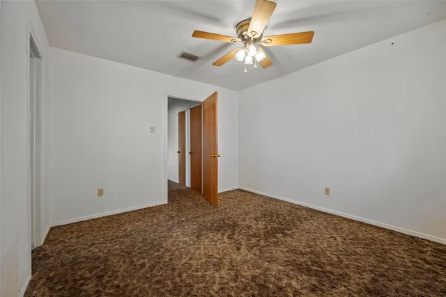 a view of a big room with carpet