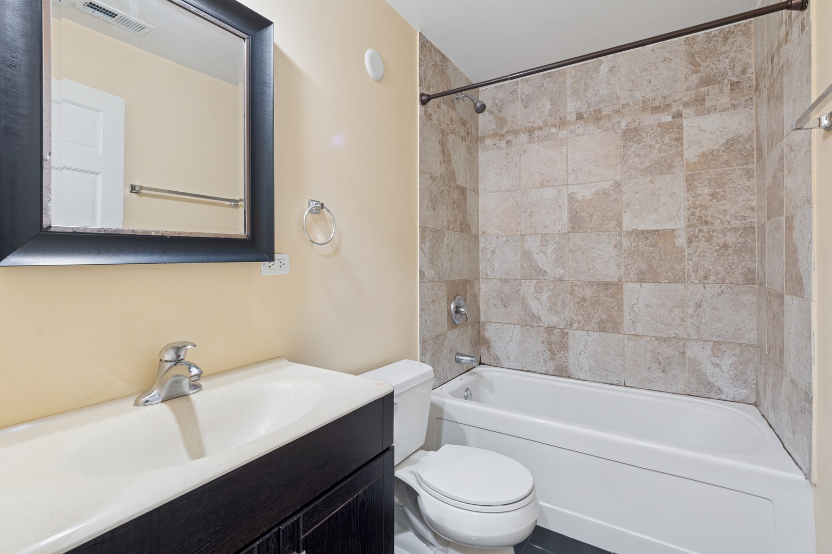 2801 West Ardmore Avenue, Unit 1A Chicago, IL 60659 - Photo 7 of 22 a bathroom with a sink a toilet and bathtub