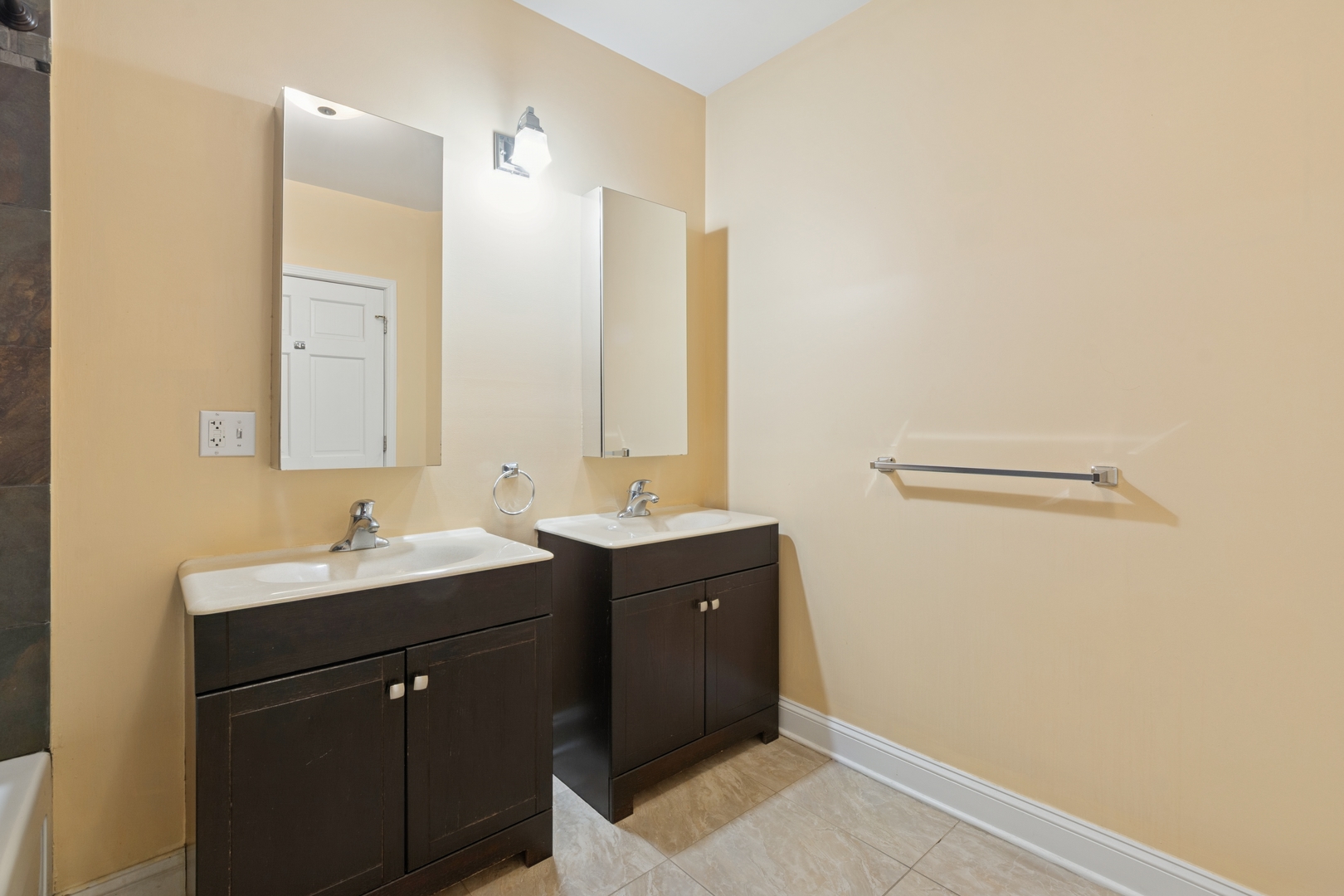 2801 West Ardmore Avenue, Unit 1A Chicago, IL 60659 - Photo 8 of 22 a bathroom with a sink and a mirror