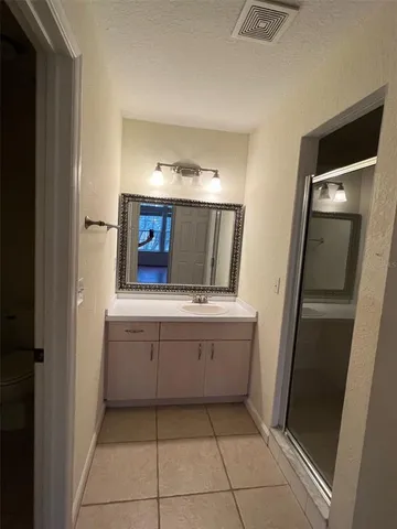 a bathroom with a tub and a sink