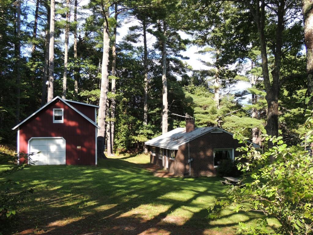 1096 Union Road Appleton, ME 04862 - Photo 8 of 22 View of cottage and garage with...
