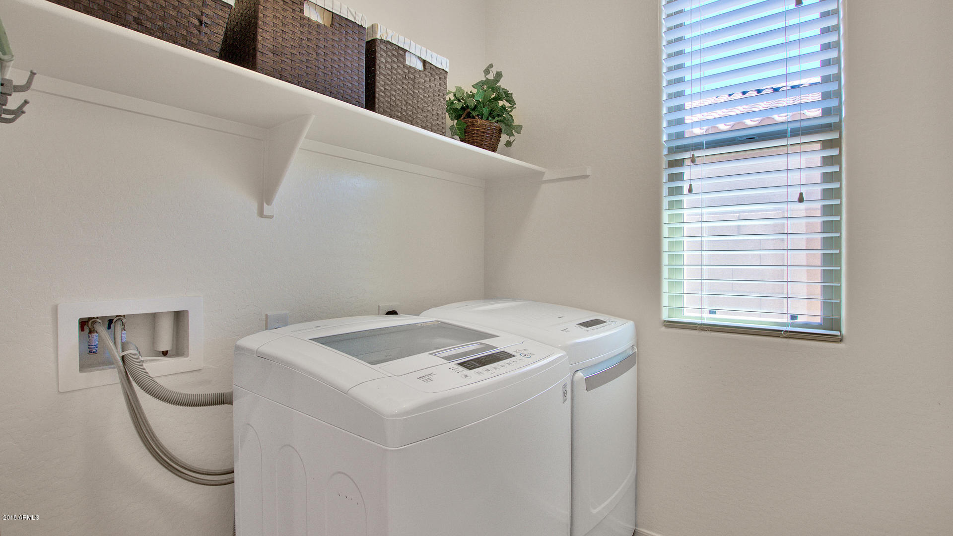 3266 East Rochelle Street Mesa, AZ 85213 - Photo 32 of 35 INSIDE LAUNDRY ROOM W/ NATURAL LIGHT