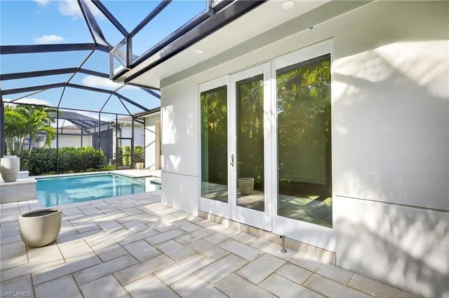 a view of a patio with a dining table and chairs