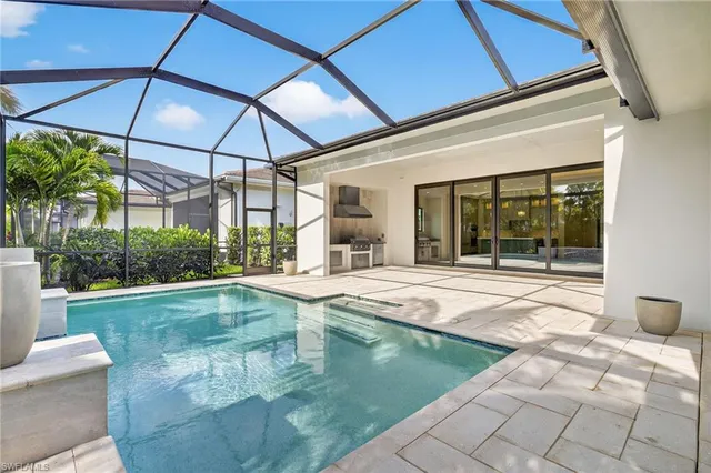 a view of a house with backyard porch and sitting area