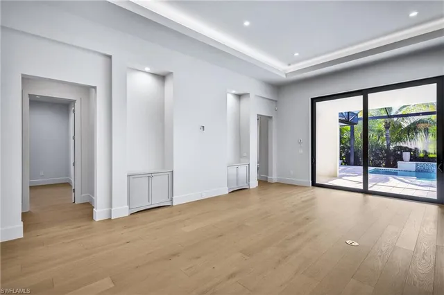 a view of empty room with floor to ceiling window