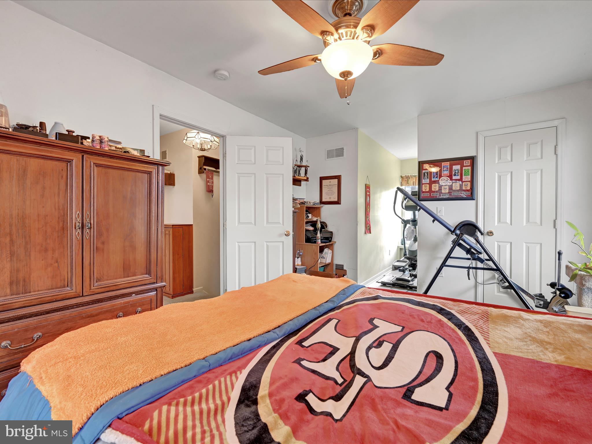 605 Wateredge Road Lititz, PA 17543 - Photo 22 of 29 a bedroom with a bed and a chandelier
