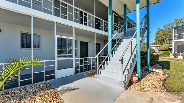 a view of a swimming pool with a yard