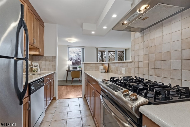 530 Valley Road, Unit 3L Montclair, NJ 07043 - Photo 11 of 25 a kitchen with a stove and a refrigerator