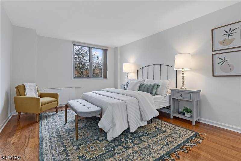 530 Valley Road, Unit 3L Montclair, NJ 07043 - Photo 15 of 25 a bedroom with a bed and a couch