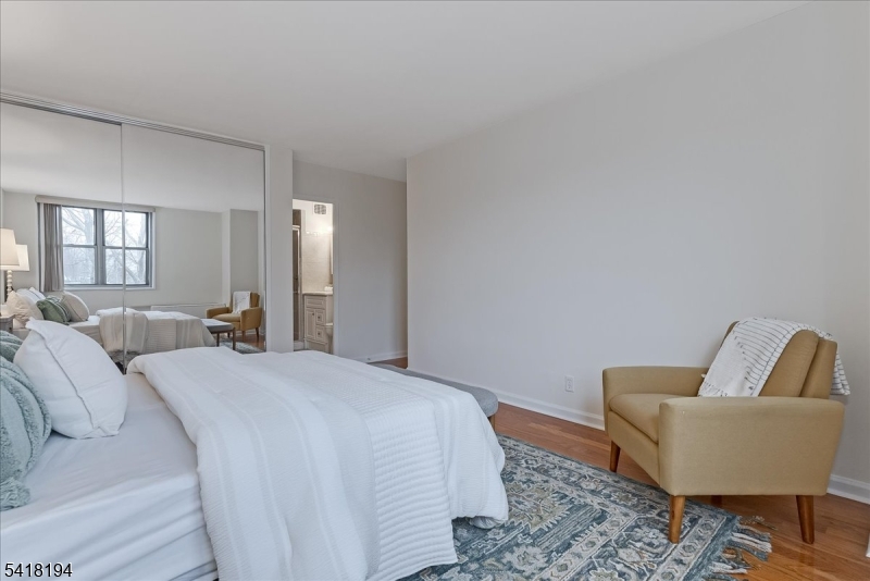 530 Valley Road, Unit 3L Montclair, NJ 07043 - Photo 16 of 25 a spacious bedroom with a bed and couch