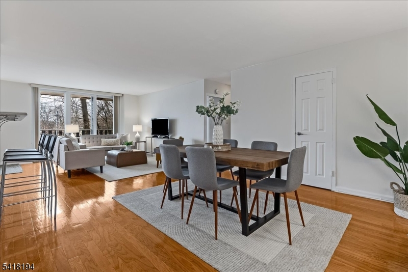 530 Valley Road, Unit 3L Montclair, NJ 07043 - Photo 2 of 25 a view of a dining room with furniture and wooden floor