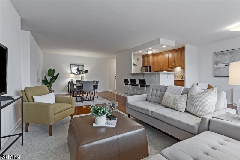 530 Valley Road, Unit 3L Montclair, NJ 07043 - Photo 3 of 25 a living room with furniture and a wooden floor