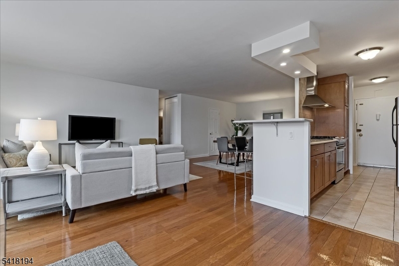 530 Valley Road, Unit 3L Montclair, NJ 07043 - Photo 6 of 25 a living room with furniture and a flat screen tv