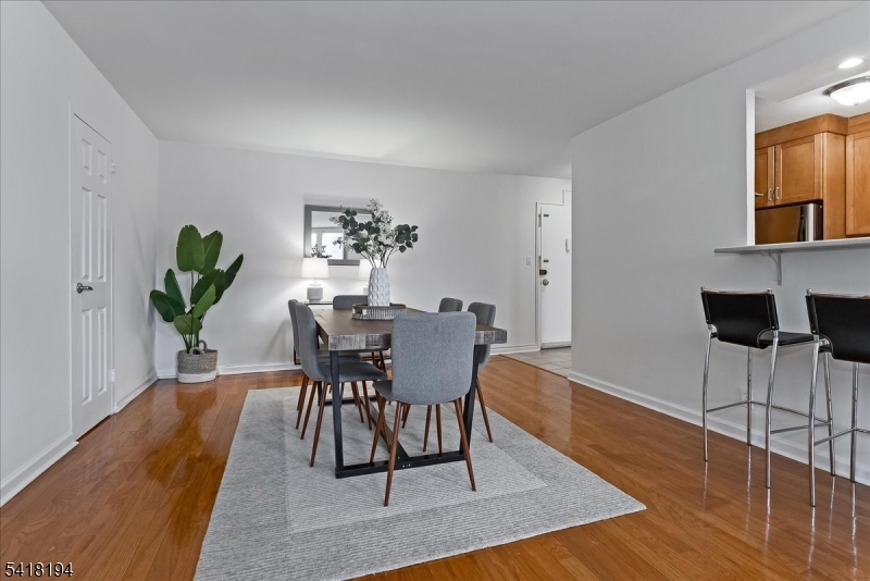 530 Valley Road, Unit 3L Montclair, NJ 07043 - Photo 9 of 25 a view of a dining room with furniture and wooden floor