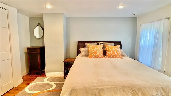 a bedroom with a bed and cabinets