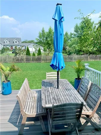 a view of a table and chairs on the roof deck