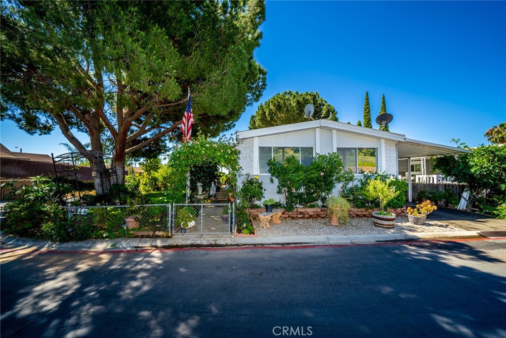 6130 Camino Real, Unit 232 Riverside, CA 92501 - Photo 1 of 1 a view of a house with backyard and plants