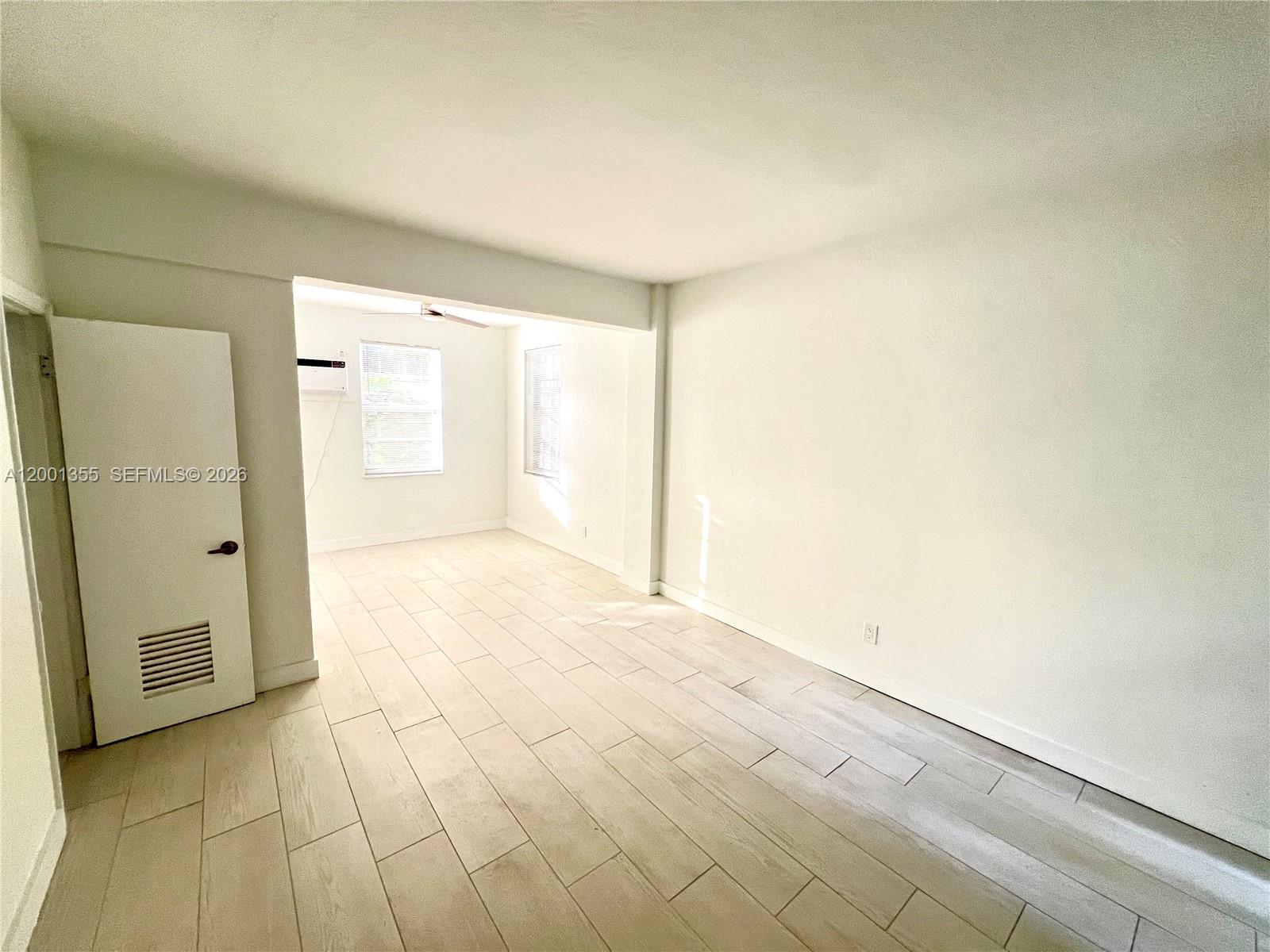 135 3rd Street, Unit 25 Miami Beach, FL 33139 - Photo 5 of 12 a view of an empty room and window