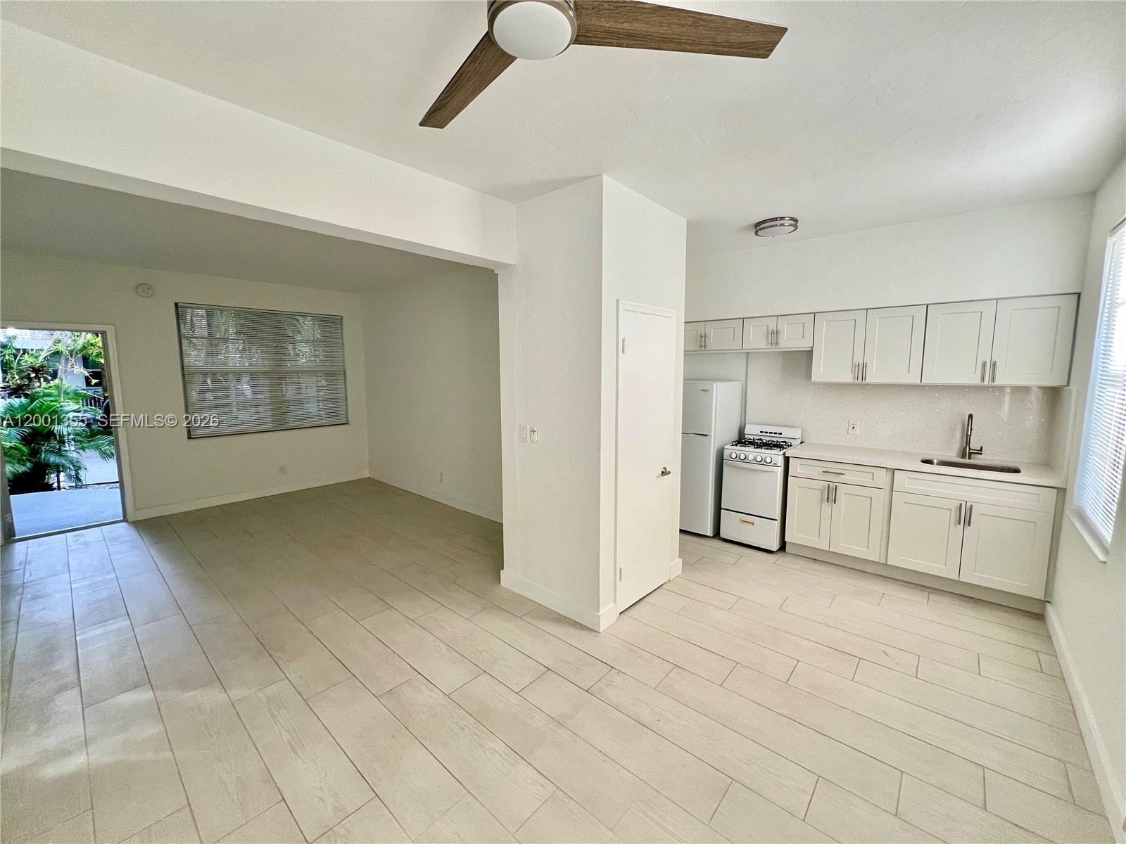 135 3rd Street, Unit 25 Miami Beach, FL 33139 - Photo 6 of 12 a view of a kitchen with electric appliances