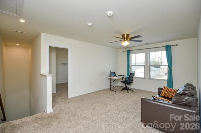 a living room with furniture and window