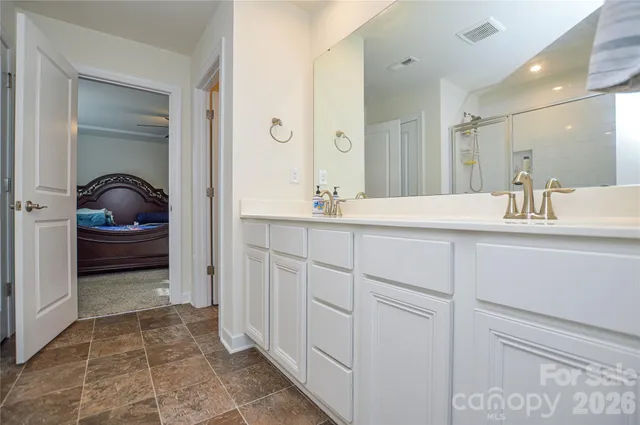 a bathroom with a sink a vanity and a mirror