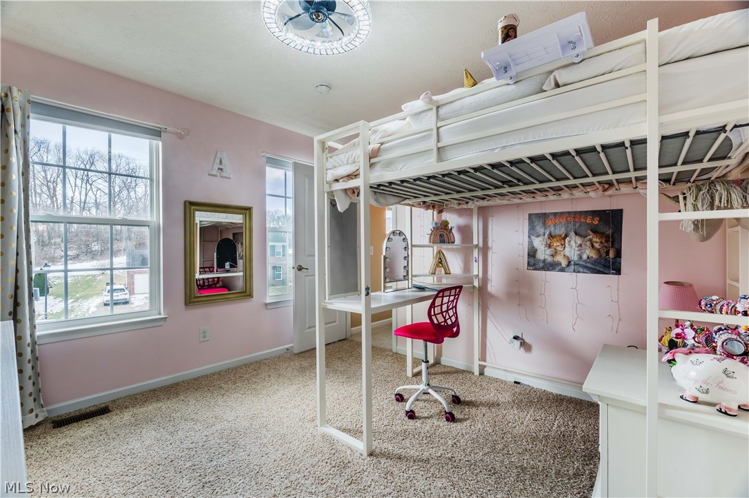 6687 List Street Northwest Canton, OH 44708 - Photo 12 of 21 Bedroom featuring light carpet and baseboards