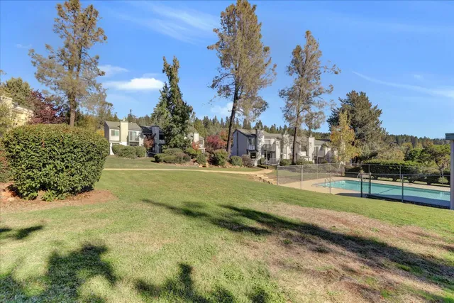 a view of a swimming pool with a house