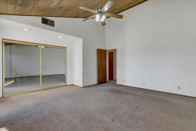 a view of a balcony with wooden floor and outdoor space