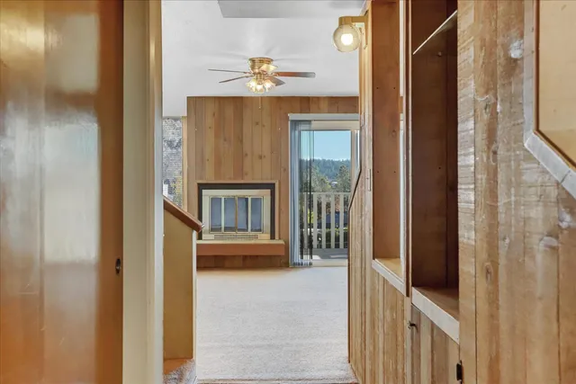 a view of a hallway with seating area