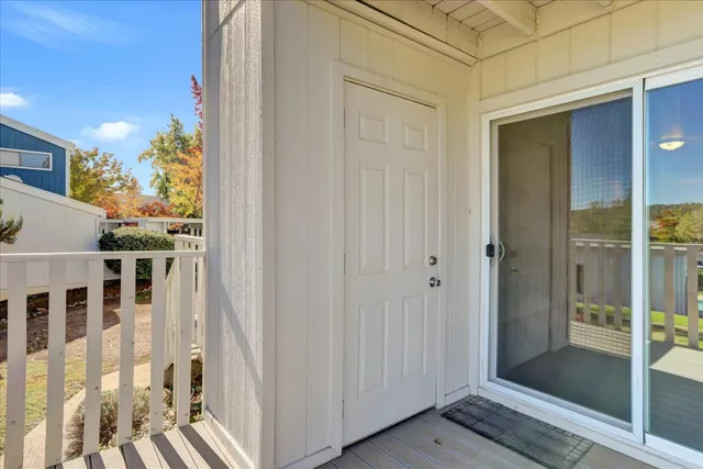 a view of a balcony with wooden floor