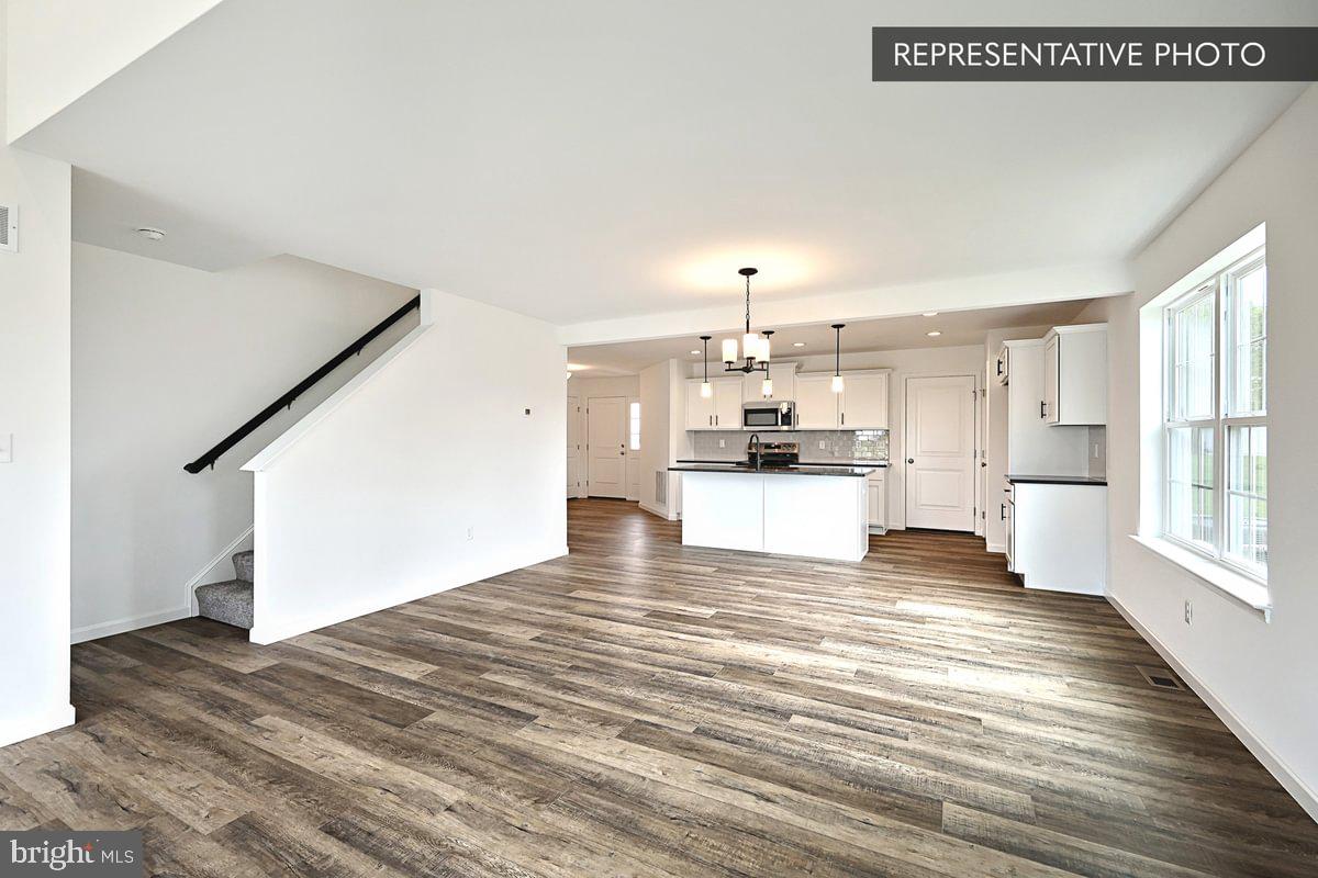 243 Abercorn Street State College, PA 16803 - Photo 13 of 21 a view of a kitchen with wooden floor and a kitchen