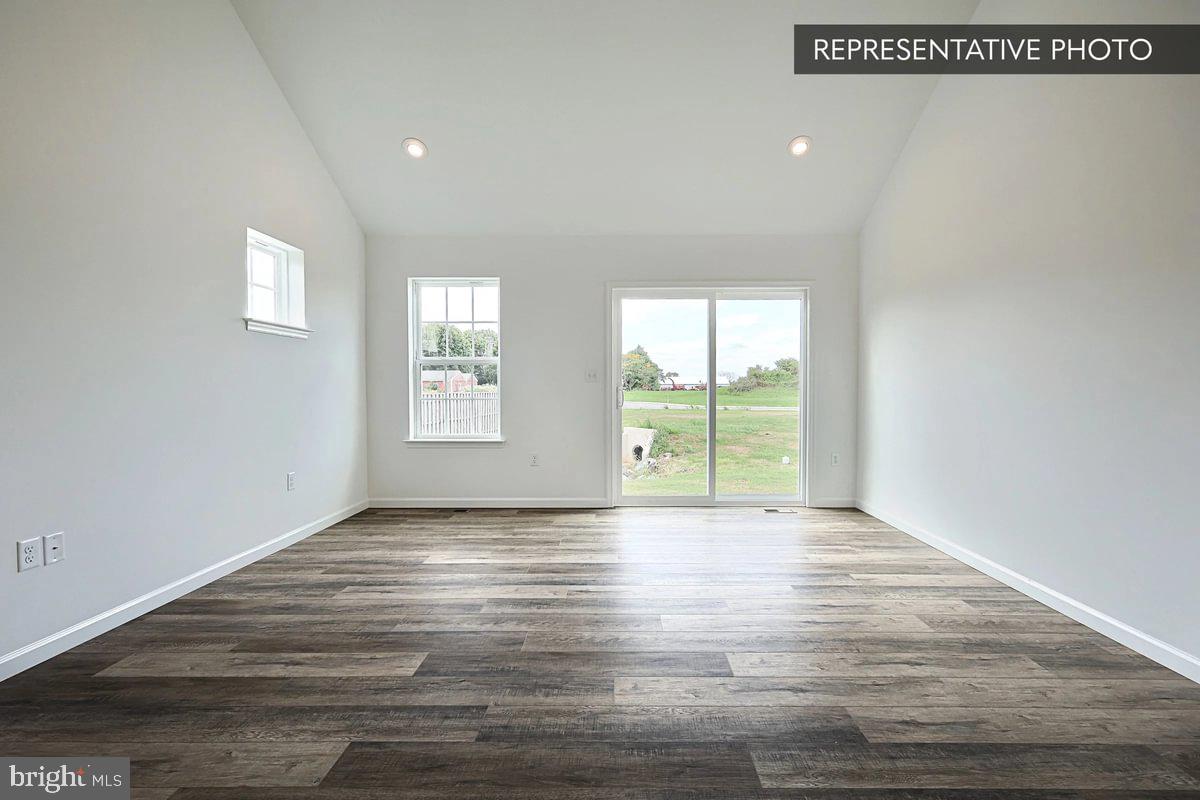 243 Abercorn Street State College, PA 16803 - Photo 14 of 21 a view of an empty room with wooden floor and a window