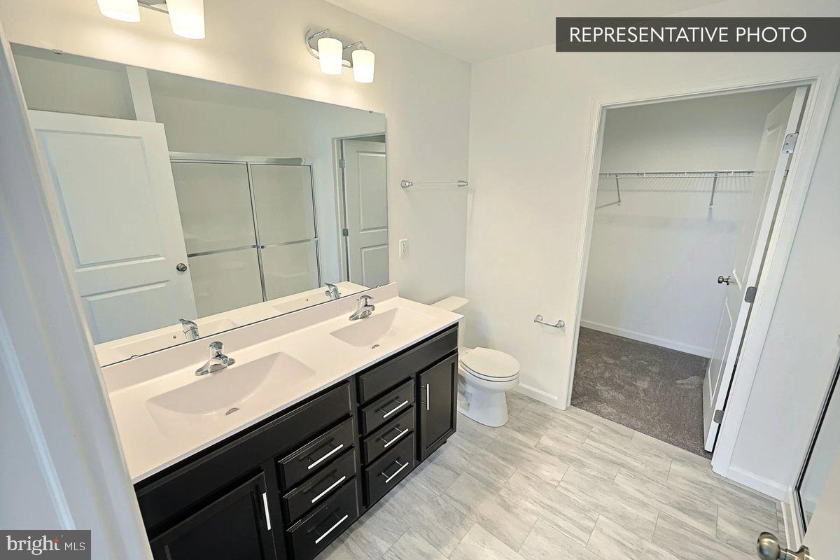 243 Abercorn Street State College, PA 16803 - Photo 17 of 21 a bathroom with a sink a toilet and shower
