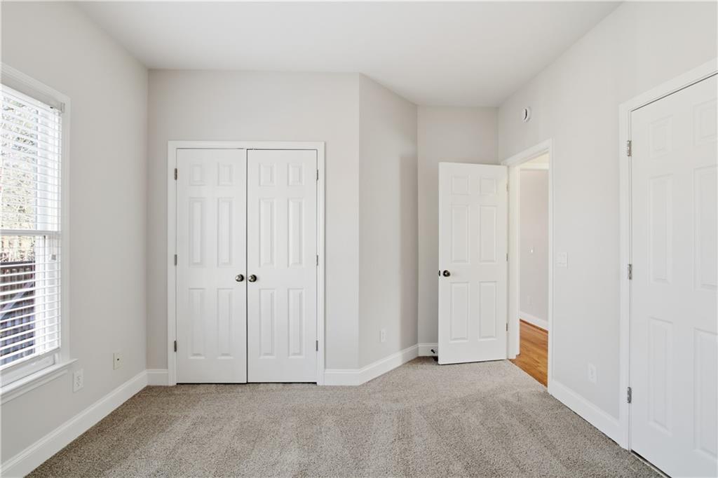 511 Highwater Pass Canton, GA 30114 - Photo 14 of 39 a view of an empty room with a window