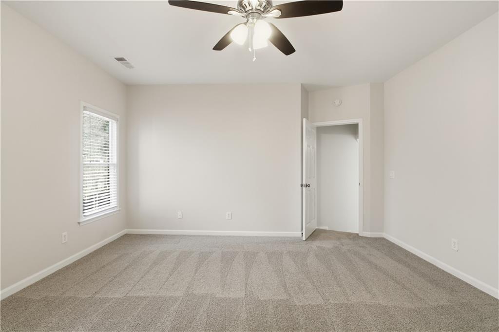511 Highwater Pass Canton, GA 30114 - Photo 18 of 39 a view of an empty room with a window