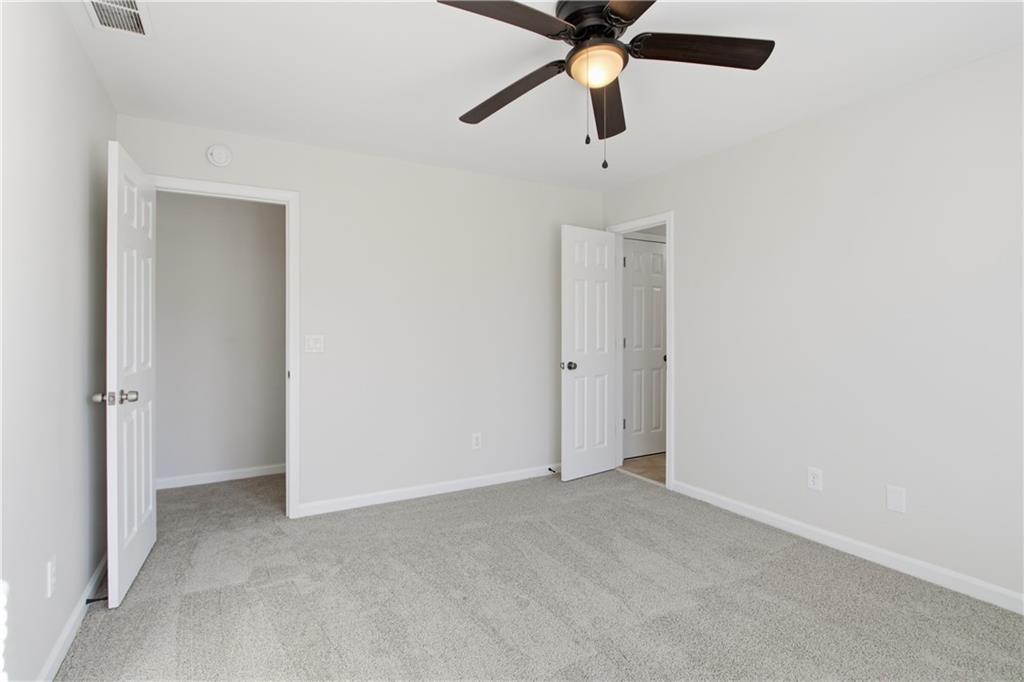 511 Highwater Pass Canton, GA 30114 - Photo 19 of 39 an empty room with a fan and a fan